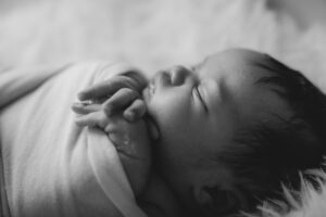 black and white photo of sleeping baby