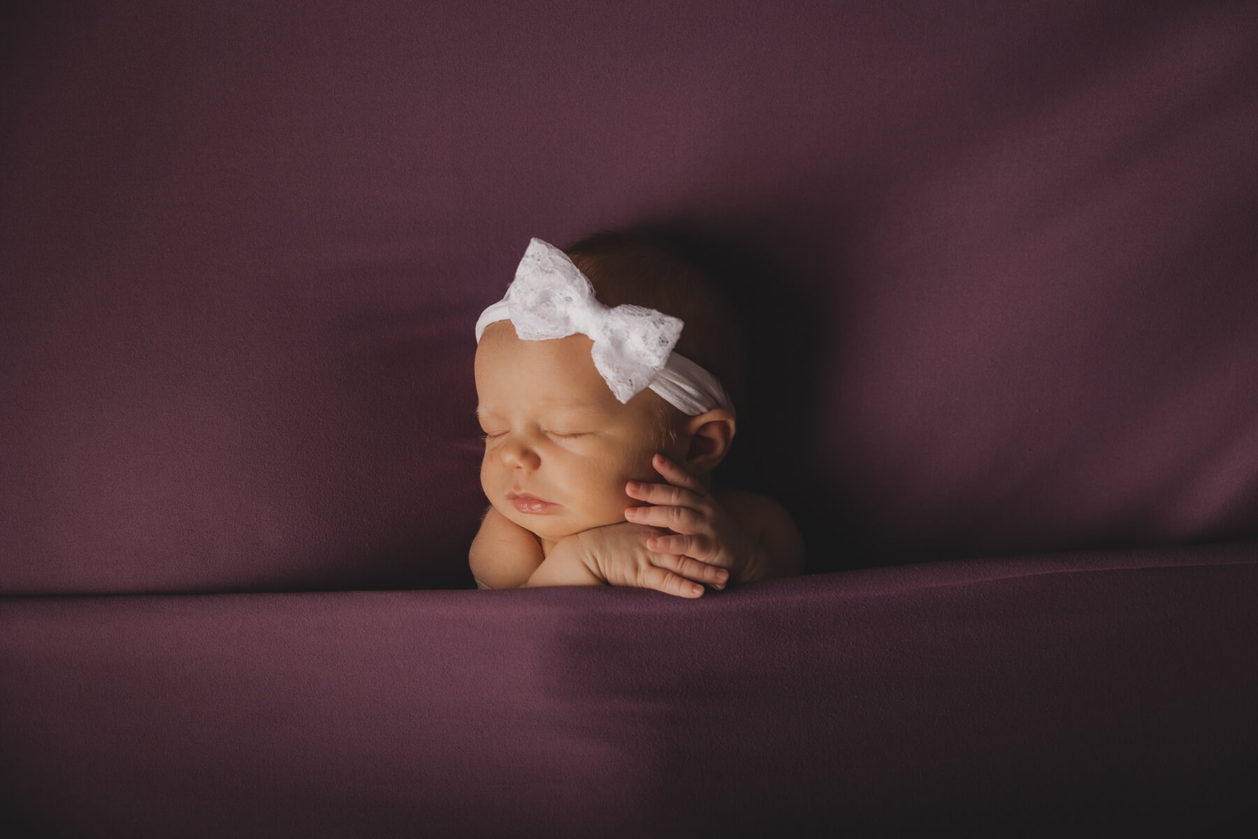 Sweet baby in purple blanket